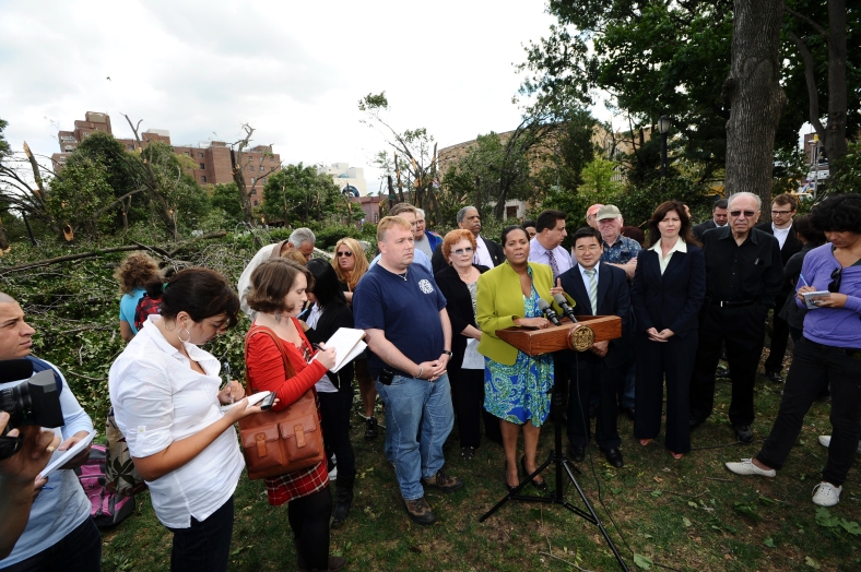 Anna, left, in red, at a press conference following a tornado in Queens. Photo by William Alatriste/NYC Council.